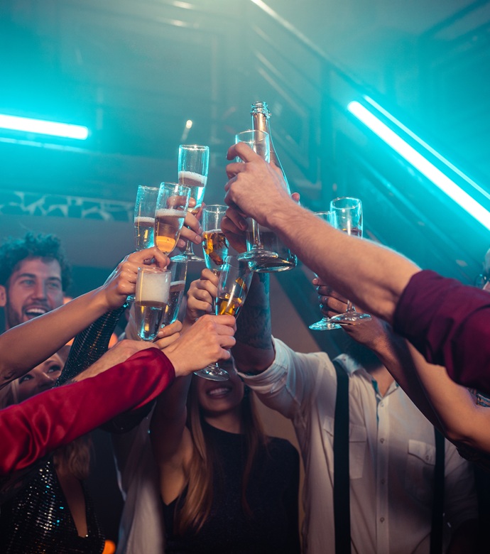 Friends toasting with champagne at an evening celebration